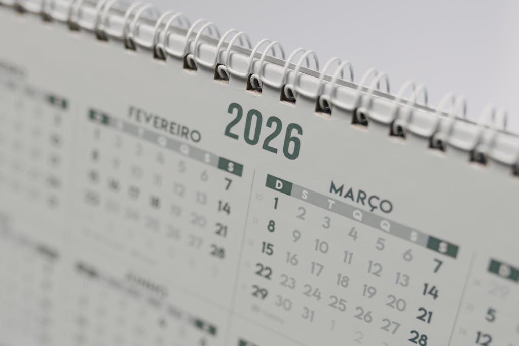 Close-up view of a 2026 spiral-bound desk calendar showing February and March.