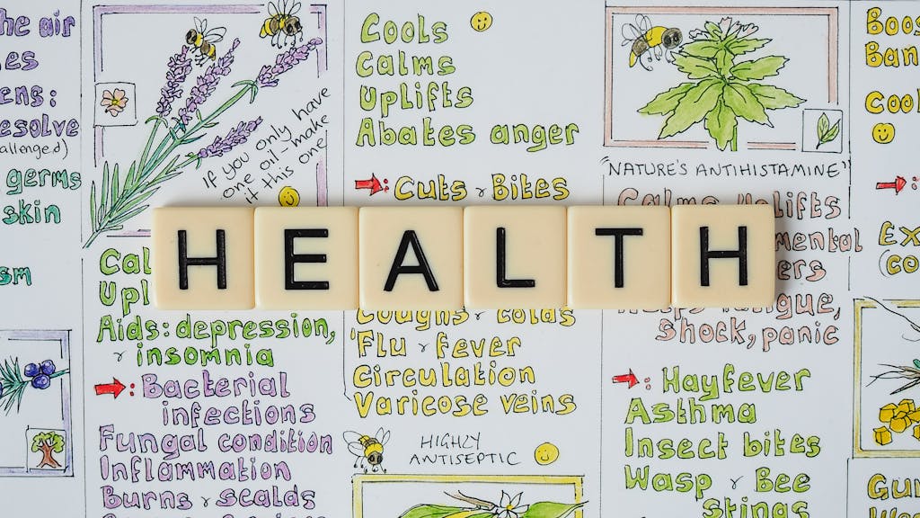 Creative representation of herbal health benefits using illustrated letter tiles spelling 'health'.